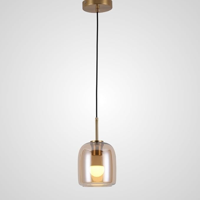 Modern pendant light with clear glass shade and gold fixture on a white background