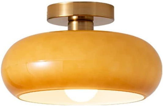 Gold ceiling light fixture on a white background