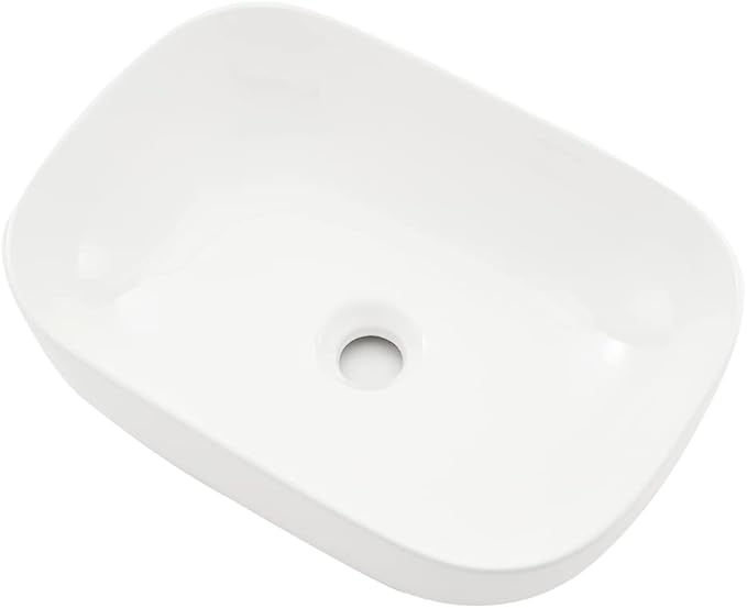 White rectangular object with a circular hole on a white background