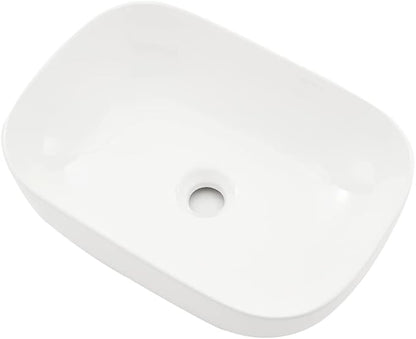White rectangular object with a circular hole on a white background