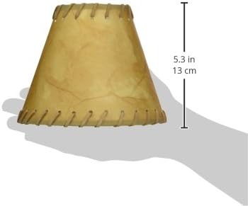 Brown leather lampshade held by a hand with measurements indicated.