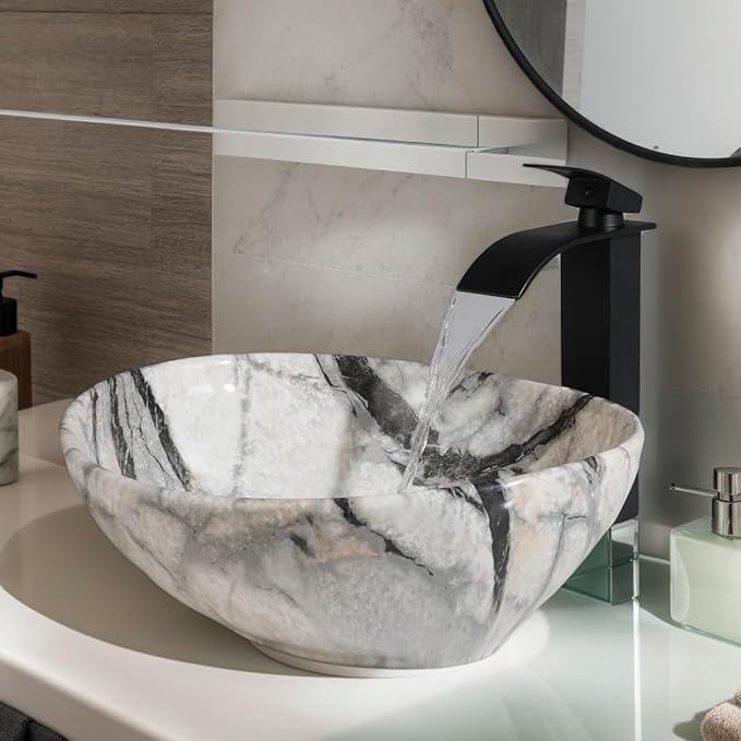 Oval Vessel Sink 16"x13" White Ceramic Bathroom Sink with Waterfall Faucet and Pop-up Drain Bowl Sink White Black Marble Bathroom Sinks Above Counter