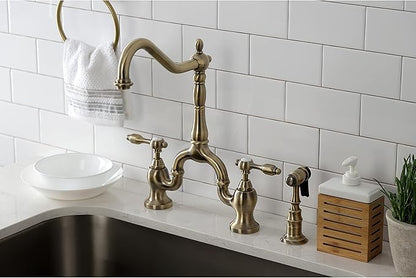 Kingston Brass KS7753TALBS Tudor Bridge Kitchen Faucet with Brass Sprayer, Antique Brass