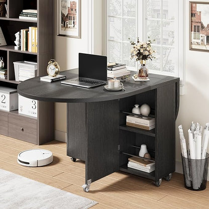 Jocoevol Round Folding Dining Table for 6, Space Saving Drop Leaf Kitchen Table with Storage Drawer, 6 Wheels Oval Gateleg Foldable Dining Table for Small Spaces (Black, 51" x 31.5" x 30")