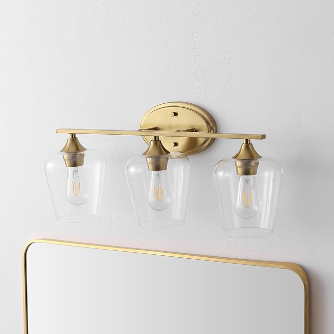 JONATHAN Y 23" Brass Gold 3-Light Farmhouse Rustic LED Vanity Light Sconce, Clear Glass Shade, Vintage Indoor Fixture for Bathroom Mirror, LED Bulb Included (JYL7547B)